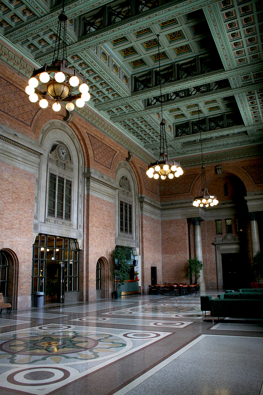 The tiled floor, brick arches and ornate ceiling of the Grand Hall.