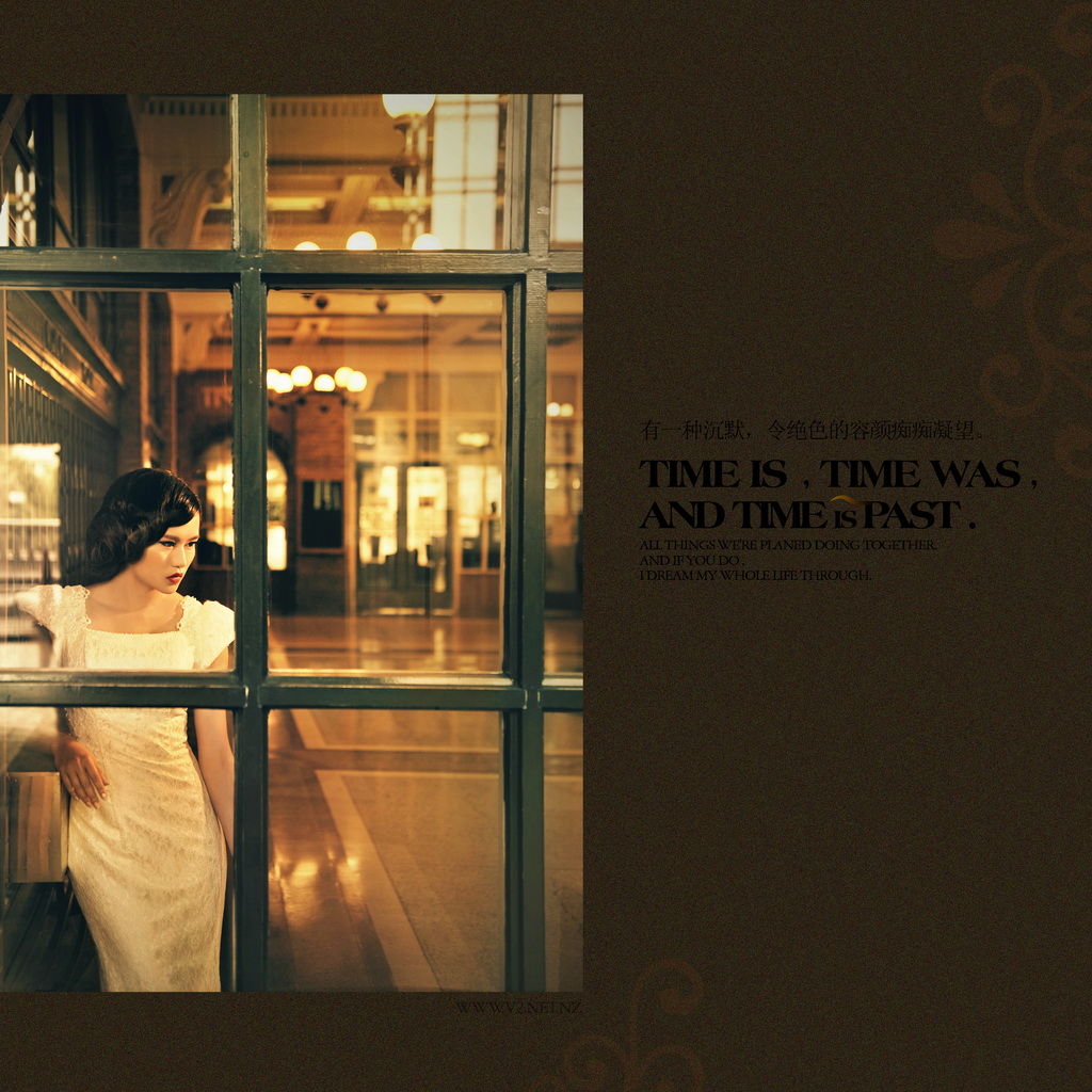 A woman in vintage styling photographed through the Booking Hall windows.